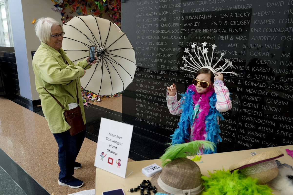 Pat Haggett, left, watches and assists her granddaughter, Phoenix Sikes, 9, on May 11 during Family Adventure Day at the FAC. Children and adults alike watched puppetry, created art and played dress up, while walking through a variety of Bemis School of Art instructors’ booths and displays. Photo by Jamie Cotten / Colorado College